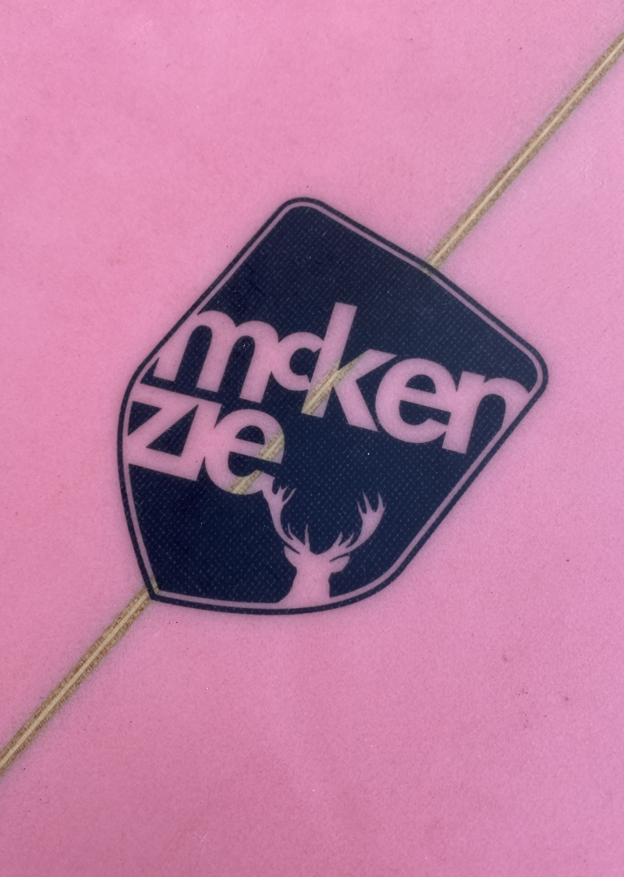 Shield logo on a surfboard
