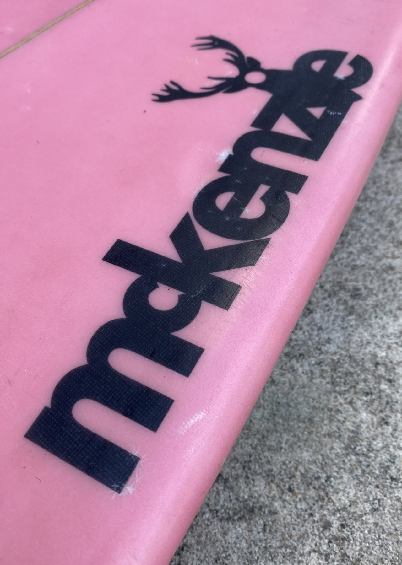 Logotype on a surfboard